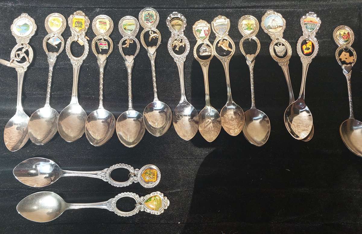 A COLLECTION OF 15 ORNATE MEMORABILIA SPOON