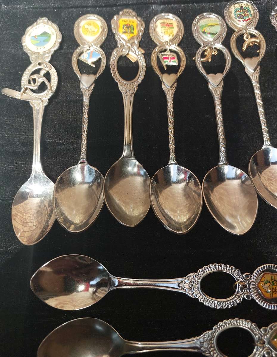 A COLLECTION OF 15 ORNATE MEMORABILIA SPOON