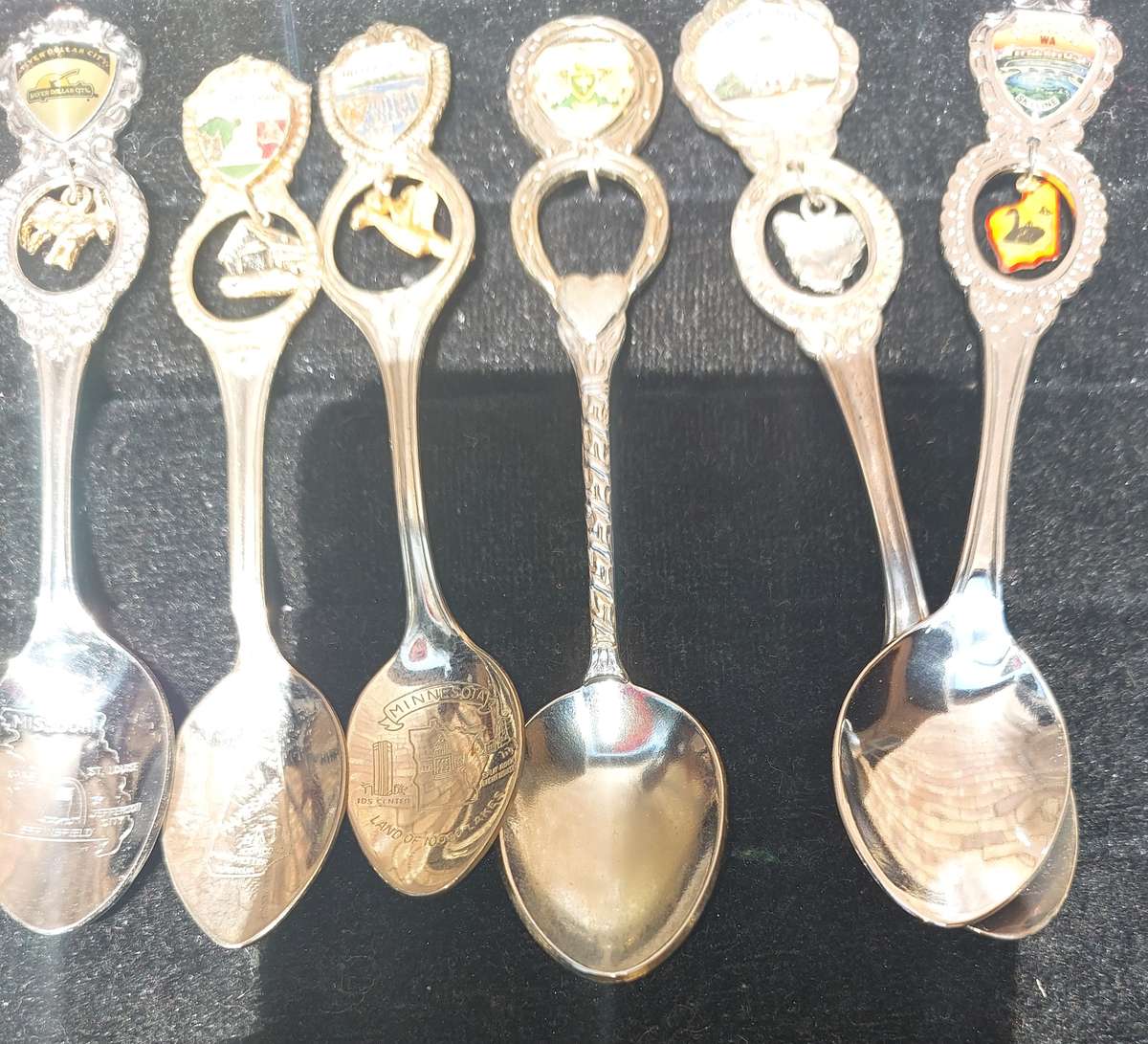 A COLLECTION OF 15 ORNATE MEMORABILIA SPOON