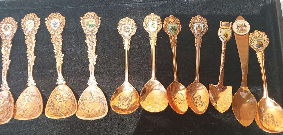 Copper African game animal memorabilia spoons - set of 11
