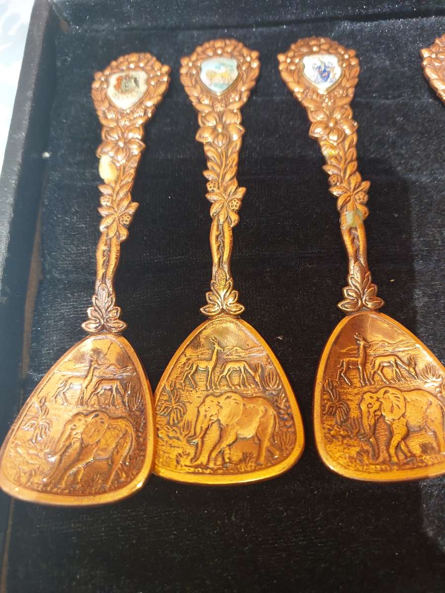 Copper African game animal memorabilia spoons - set of 11