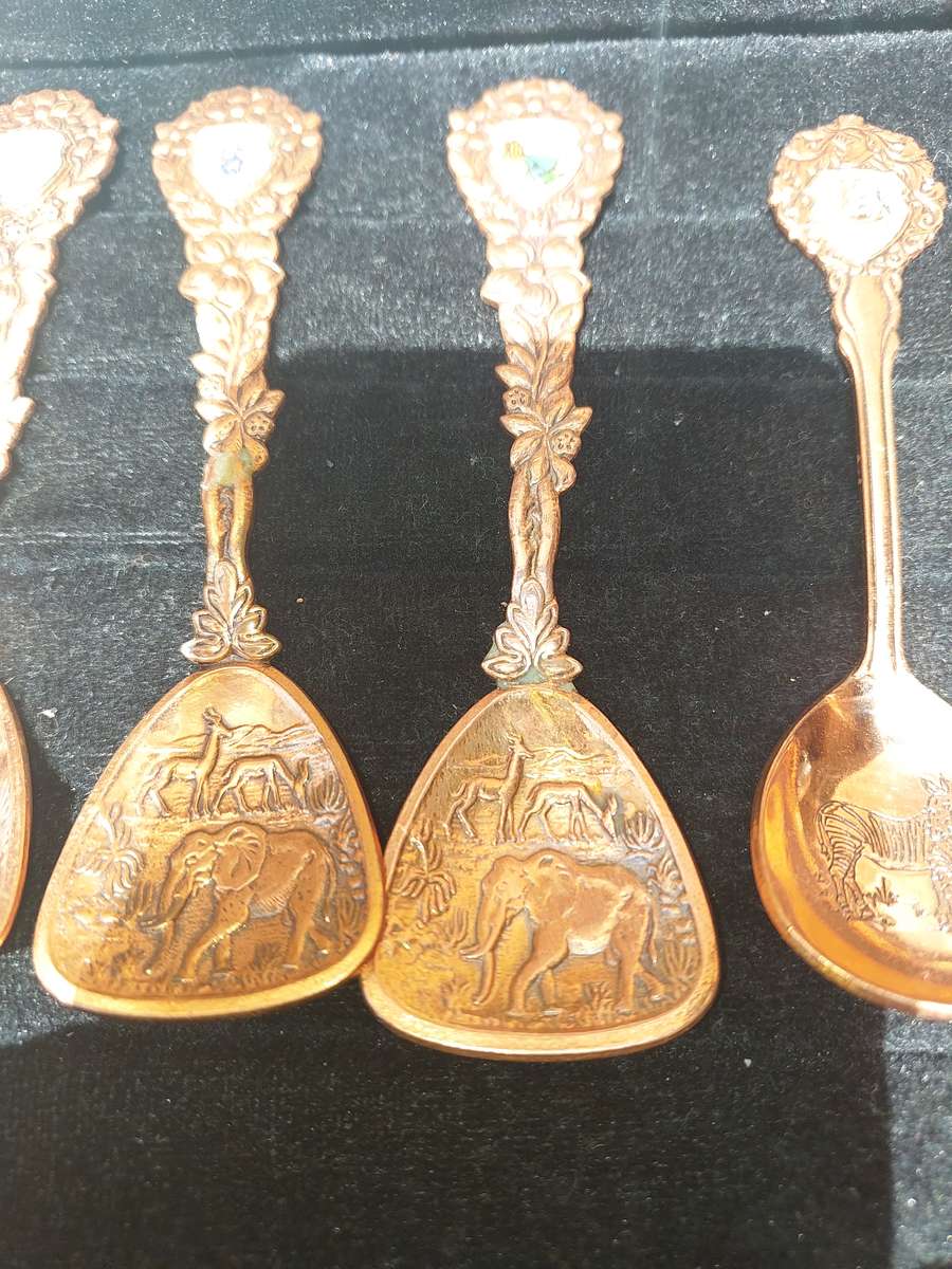 Copper African game animal memorabilia spoons - set of 11
