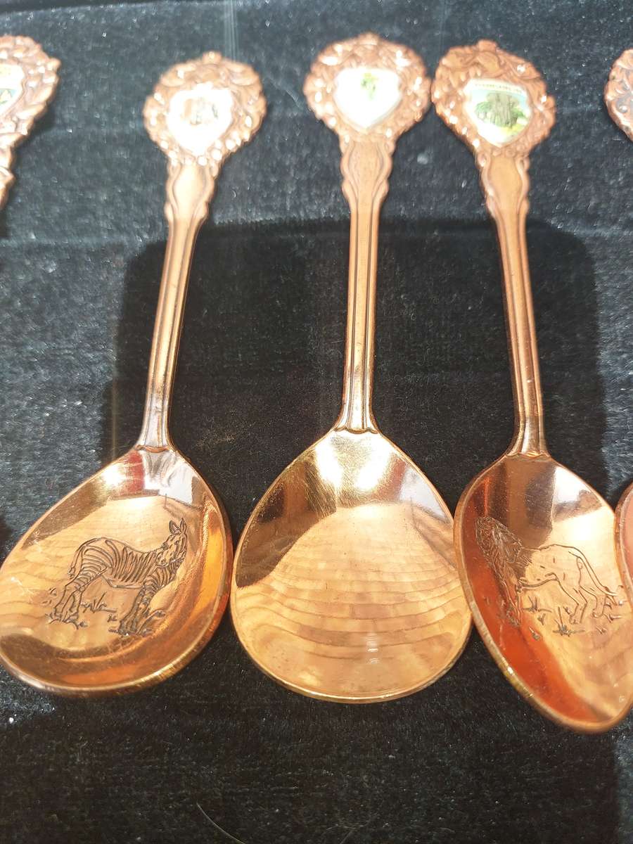 Copper African game animal memorabilia spoons - set of 11
