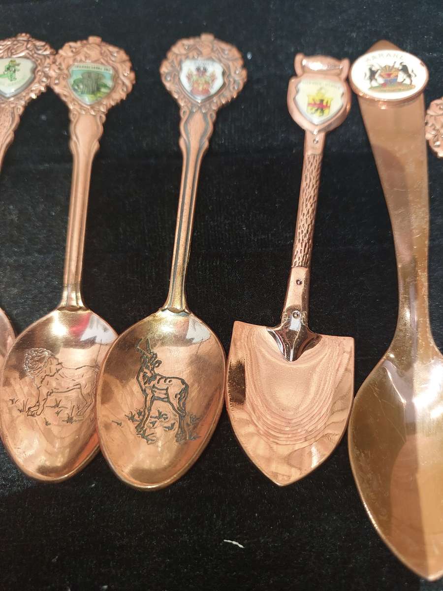 Copper African game animal memorabilia spoons - set of 11