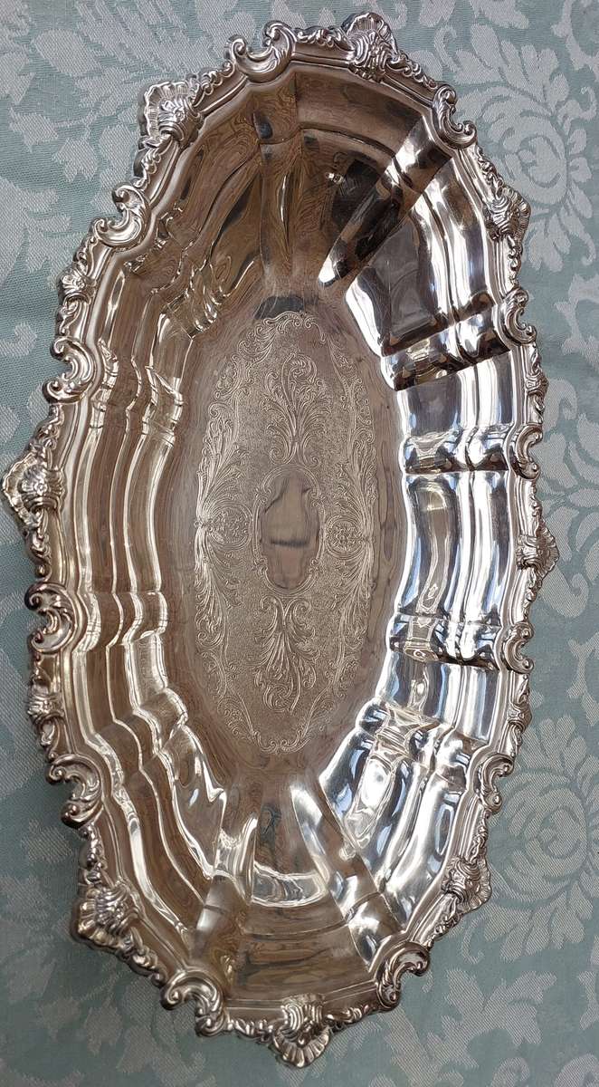 AN OVAL VICTORIAN DESIGN SILVER PLATED SERVING TRAY
