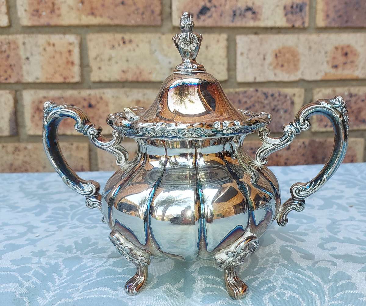 A VINTAGE VICTORIAN SILVER PLATED  JUG TEA SET THAT NEEDS SOME REPAIRS