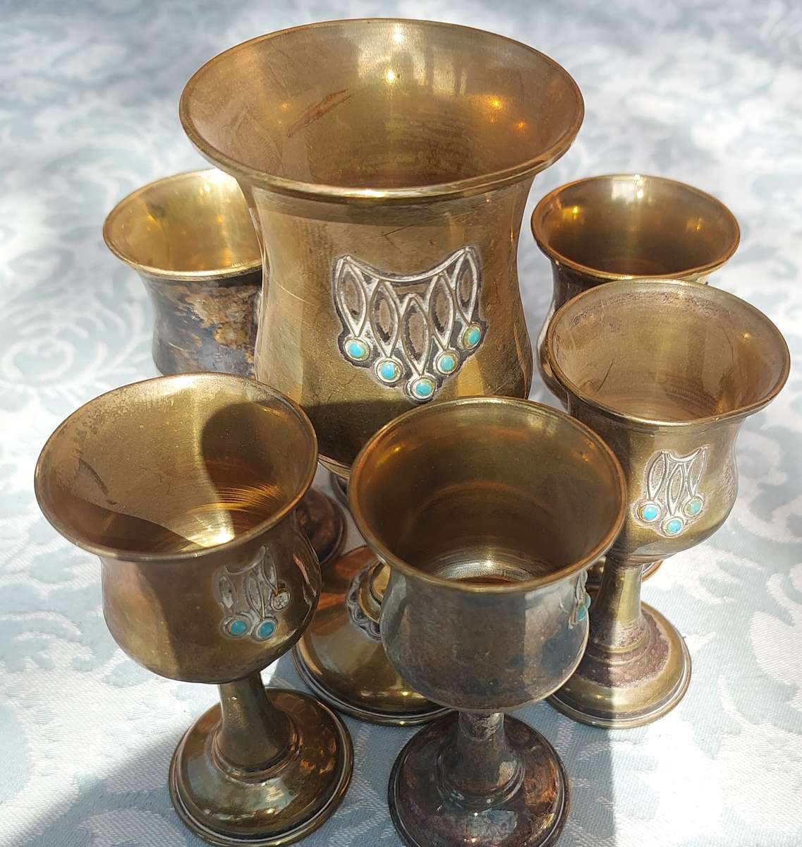 A VINTAGE BRASS KIDDUSH SET