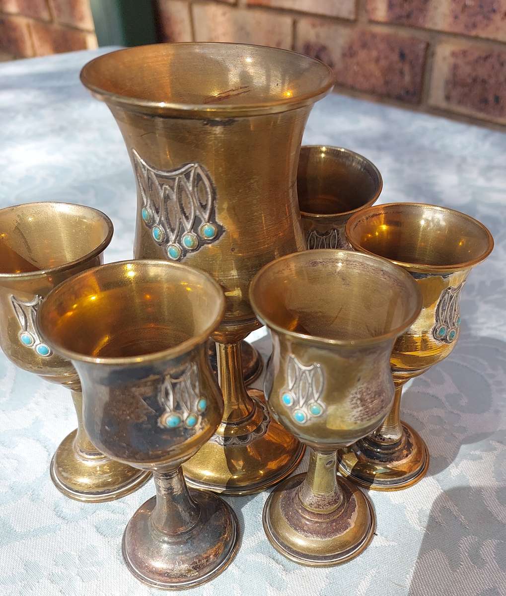 A VINTAGE BRASS KIDDUSH SET