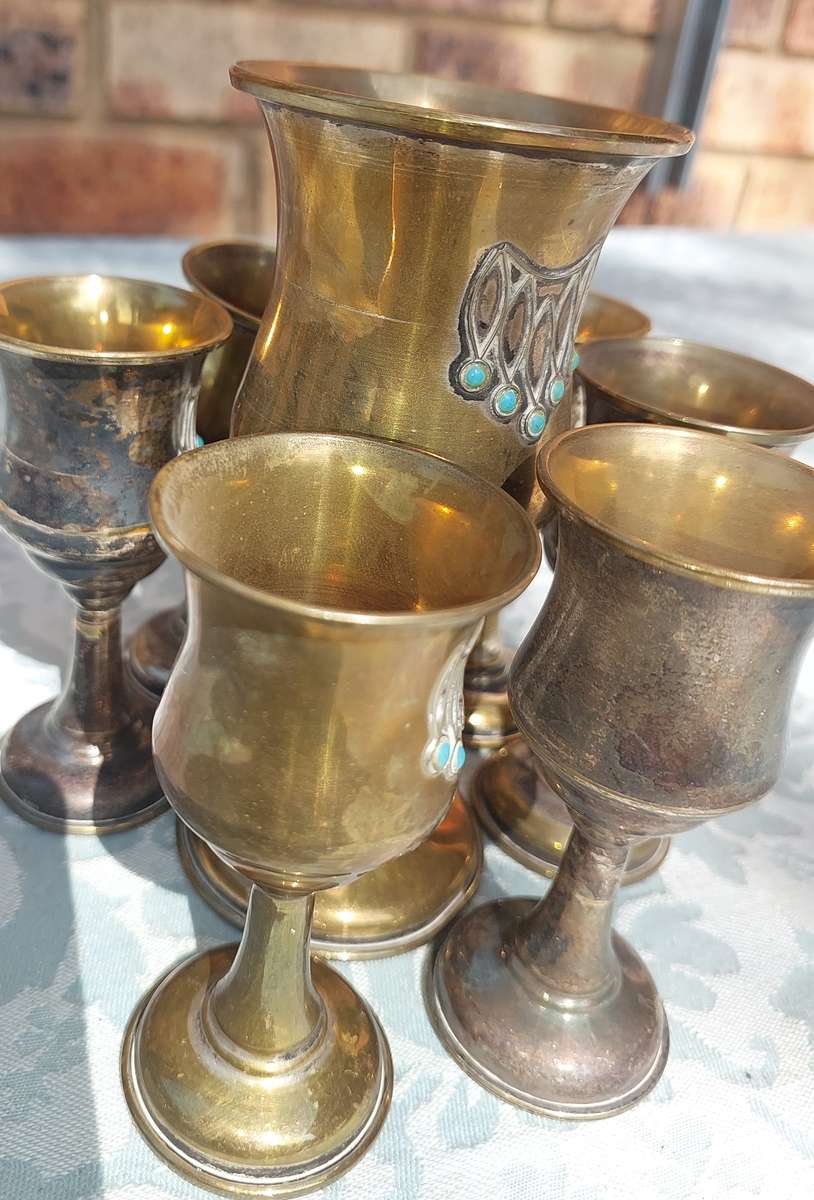 A VINTAGE BRASS KIDDUSH SET