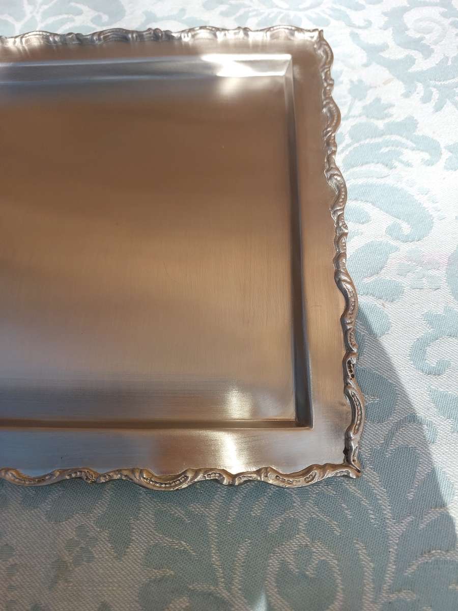 A SQUARE STAINLESS STEEL SERVING TRAY