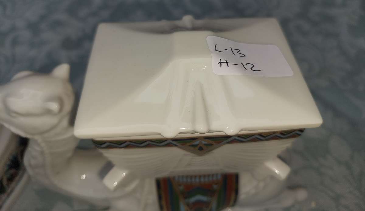 A COLLECTION OF PORCELAIN FIGURINES AND ORNAMENTS SOLD AS IS