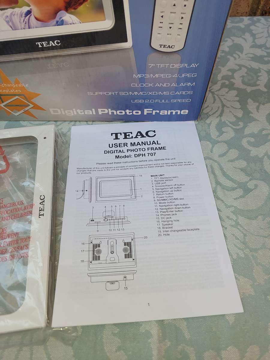 A TEAC DIGITAL PHOTO FRAME WITH ALL THE PAPERWORK SOLD AS IS NOT TESTED