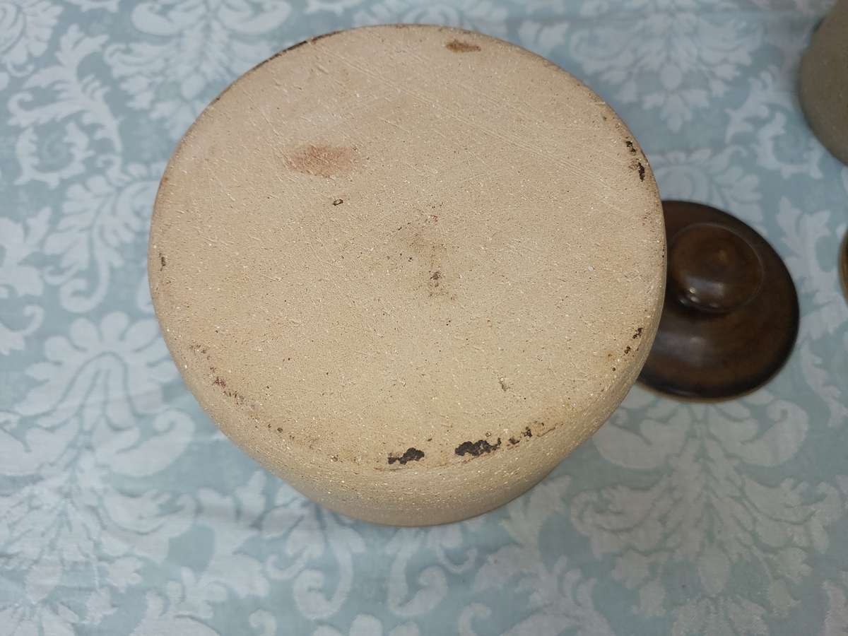 A PAIR OF STONEWARE STORAGE JARS SOLD AS IS