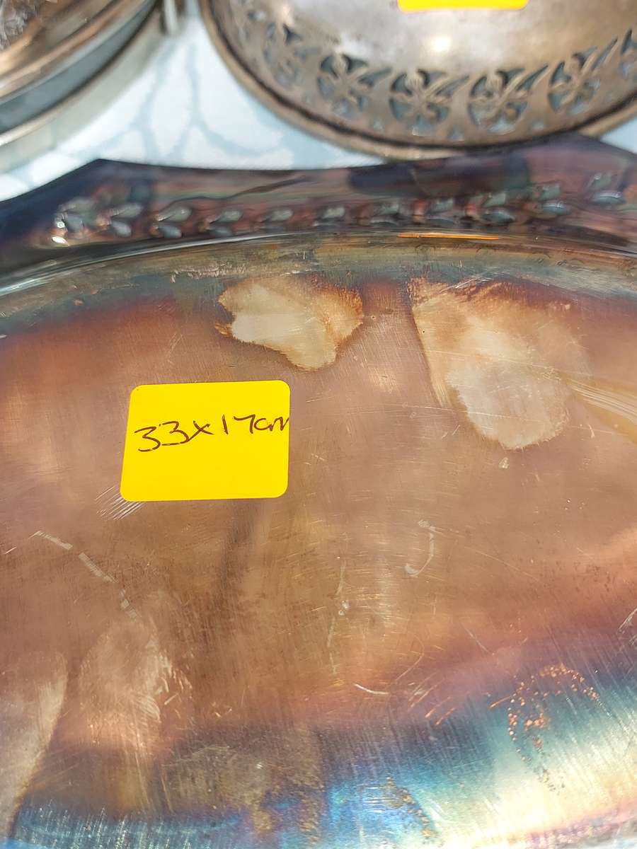 A VINTAGE COLLECTION SILVER PLATED SERVING UTENSILS SOLD AS IS