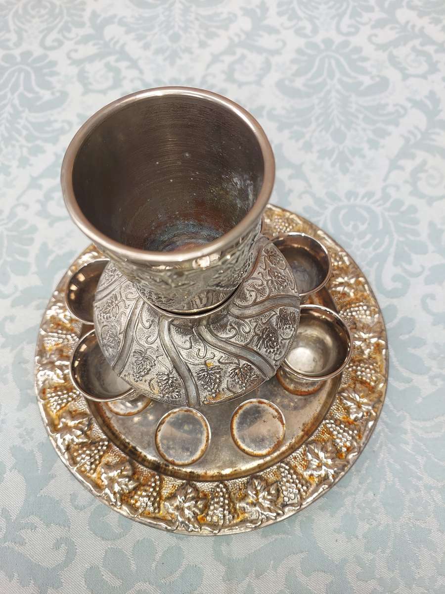 A VINTAGE KIDDUSH SET WITH 2 CUPS MISSING SOLD AS IS