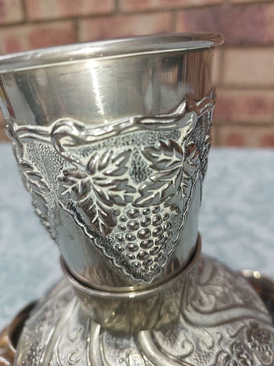 A VINTAGE KIDDUSH SET WITH 2 CUPS MISSING SOLD AS IS