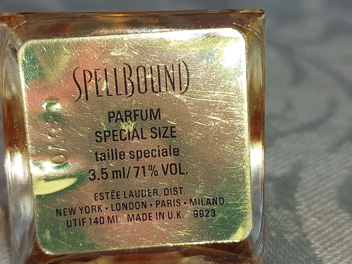 A COLLECTION OF MINITURE LALIQUE PERFUME BOTTLES AND SOME HAVE PERFUMES IN IT SOLD AS IS