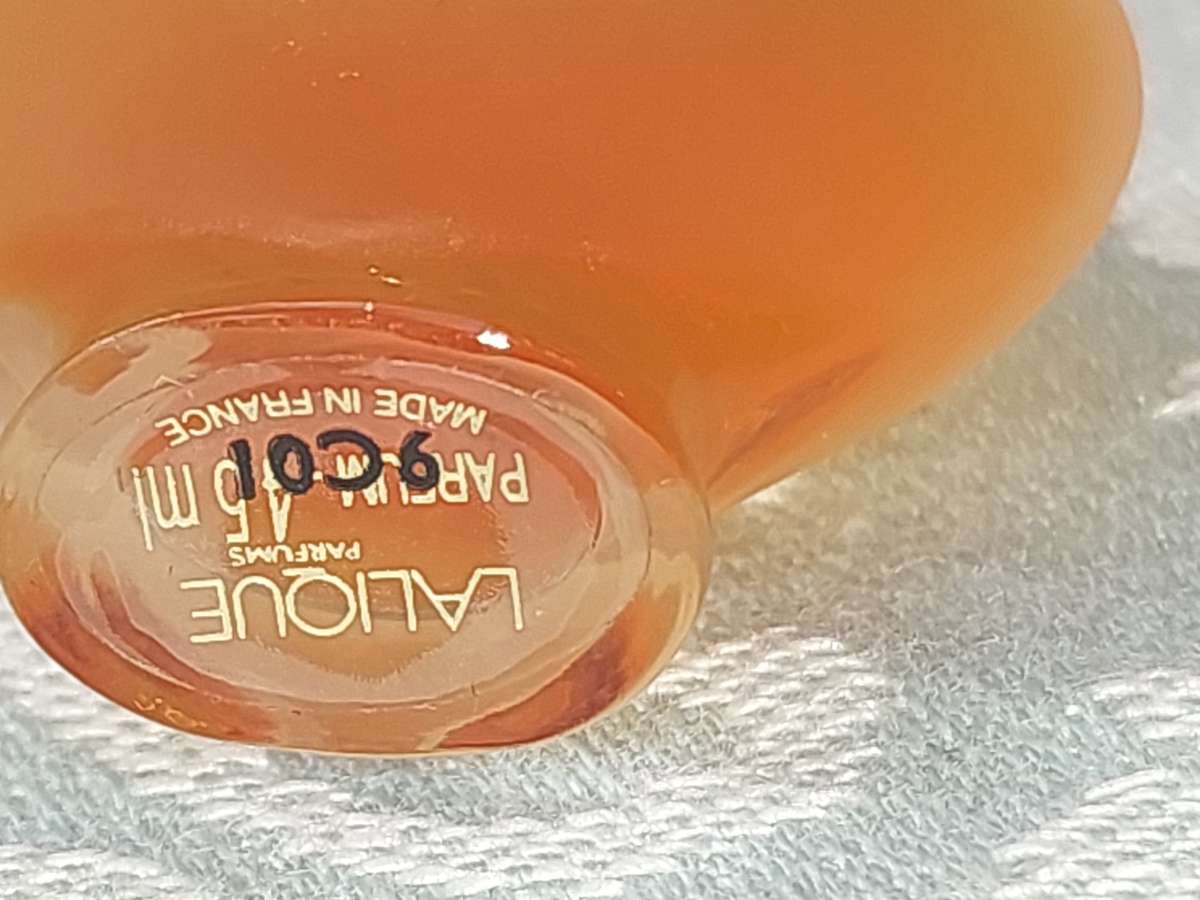 A COLLECTION OF MINITURE LALIQUE PERFUME BOTTLES AND SOME HAVE PERFUMES IN IT SOLD AS IS