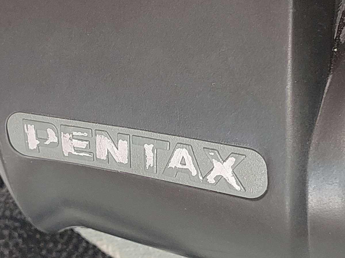A USED PENTAX 10X50  6.5 XCF BINOCULARS SOLD AS IS