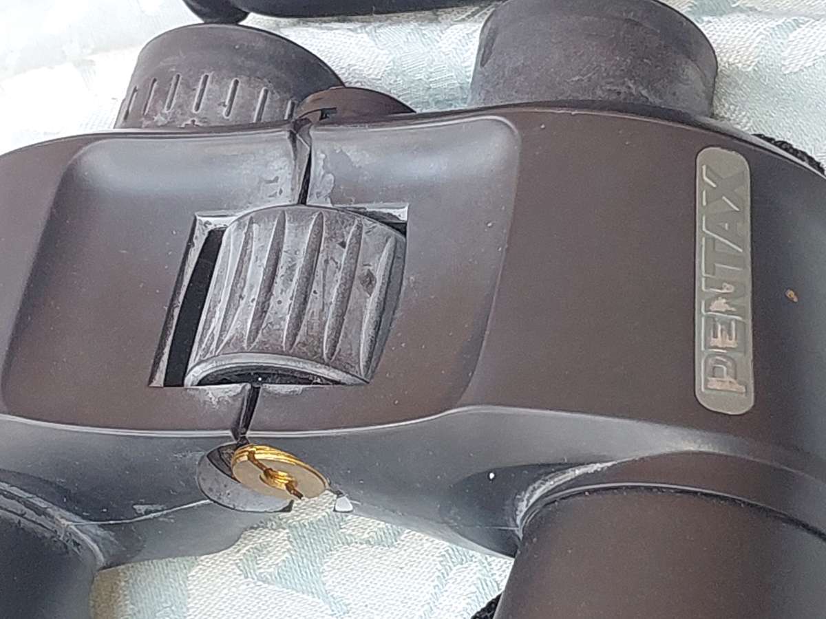 A USED PENTAX 10X50  6.5 XCF BINOCULARS SOLD AS IS