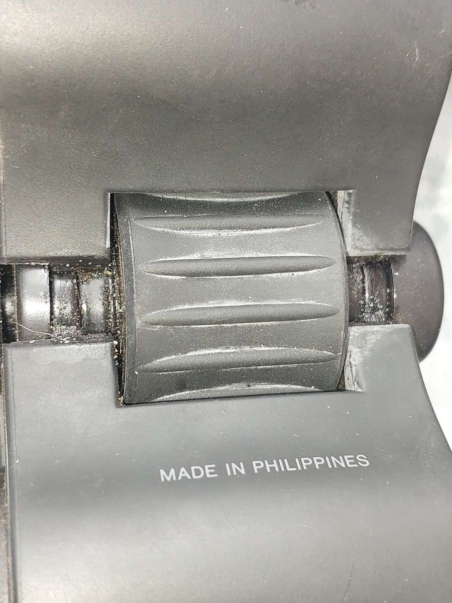 A USED PENTAX 10X50 BINOCULARS SOLD AS IS