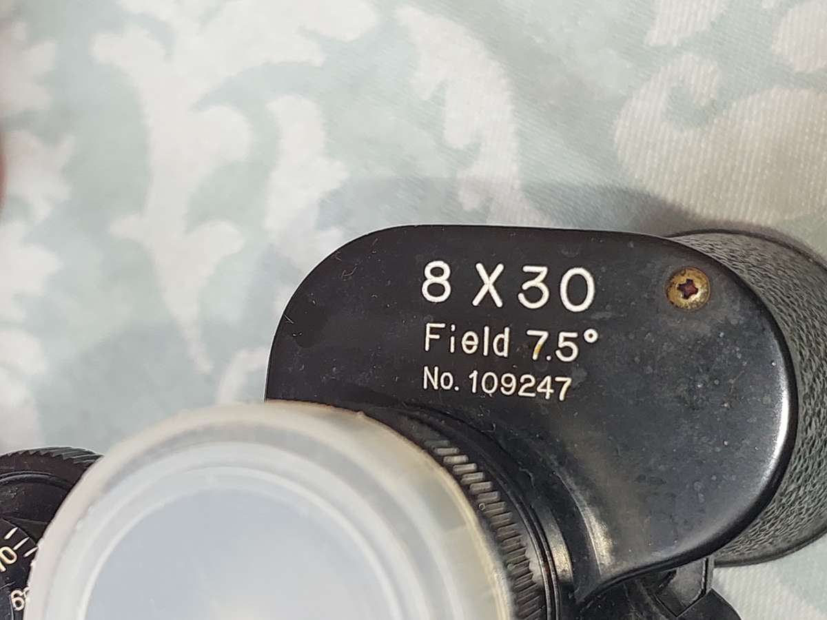 A VINTAGE ATLAS 8X30MM BINOCULARS SOLD AS IS