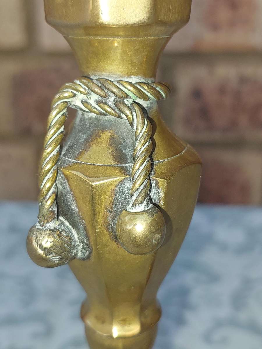 A VINTAGE PAIR OF VICTORIAN BRASS CANDLE HOLDER SOLD AS IS