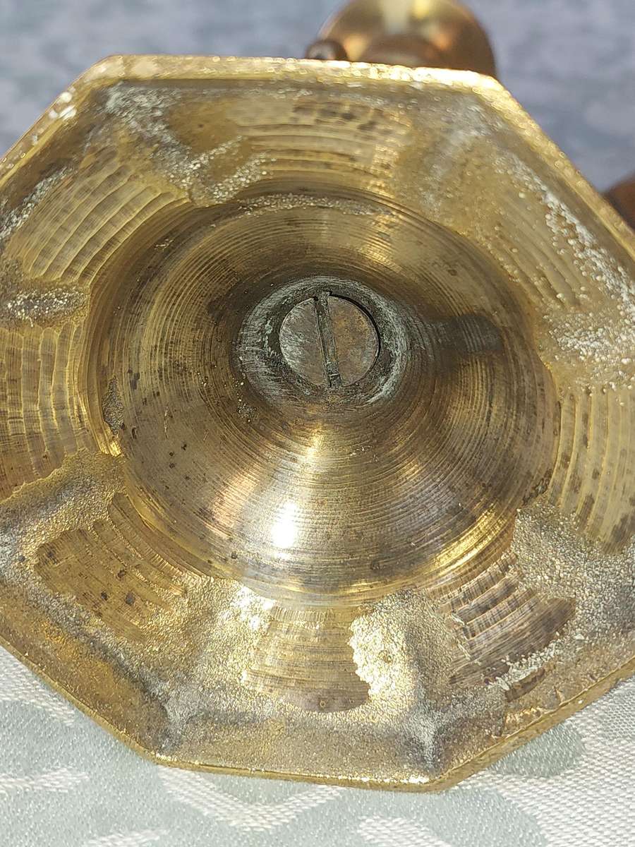 A VINTAGE PAIR OF VICTORIAN BRASS CANDLE HOLDER SOLD AS IS