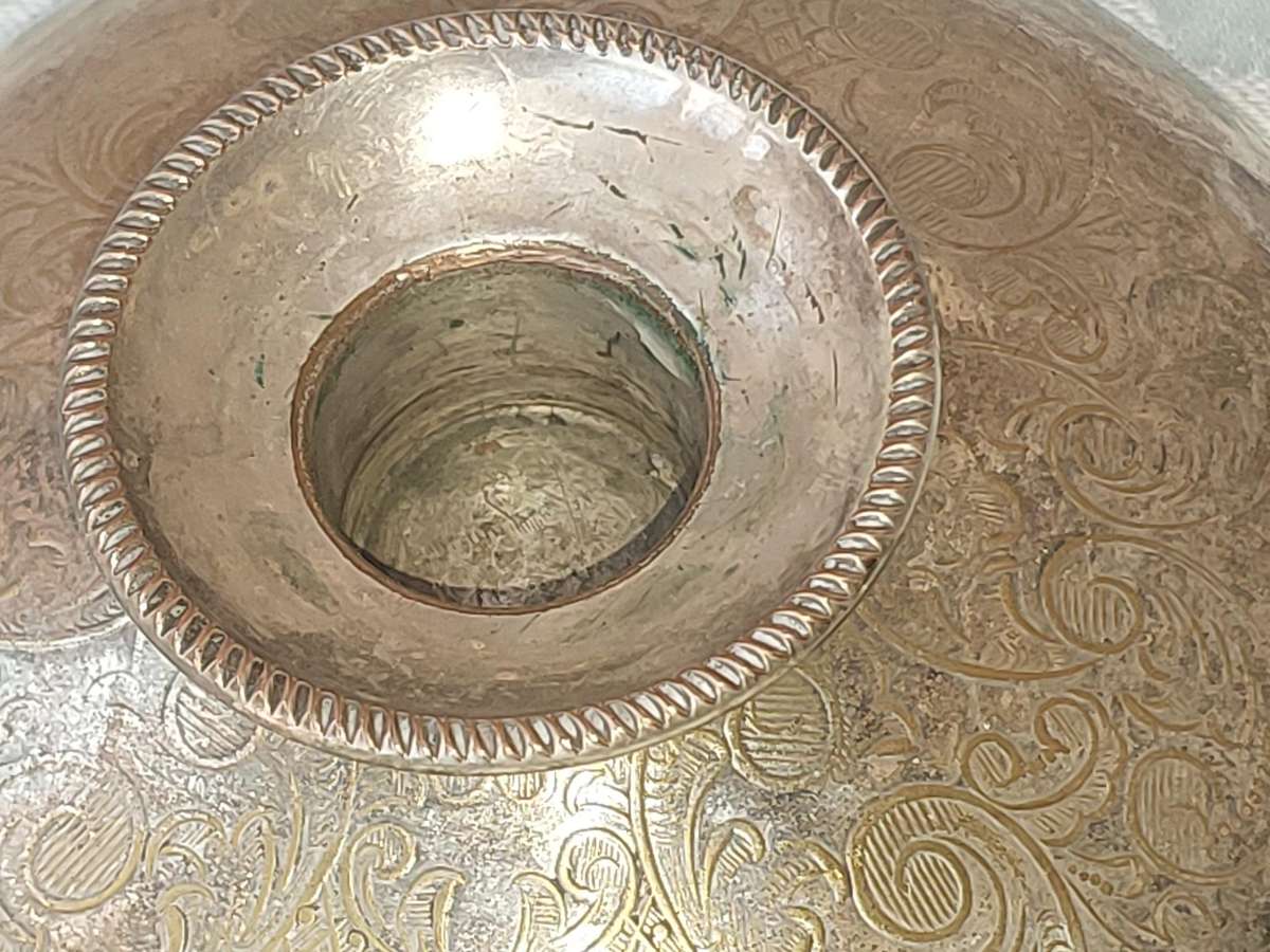 A PAIR OF SILVER PLATE ENGLAND CANDLE HOLDERS WITH ART WORK ENGRAVINGS SOLD AS IS