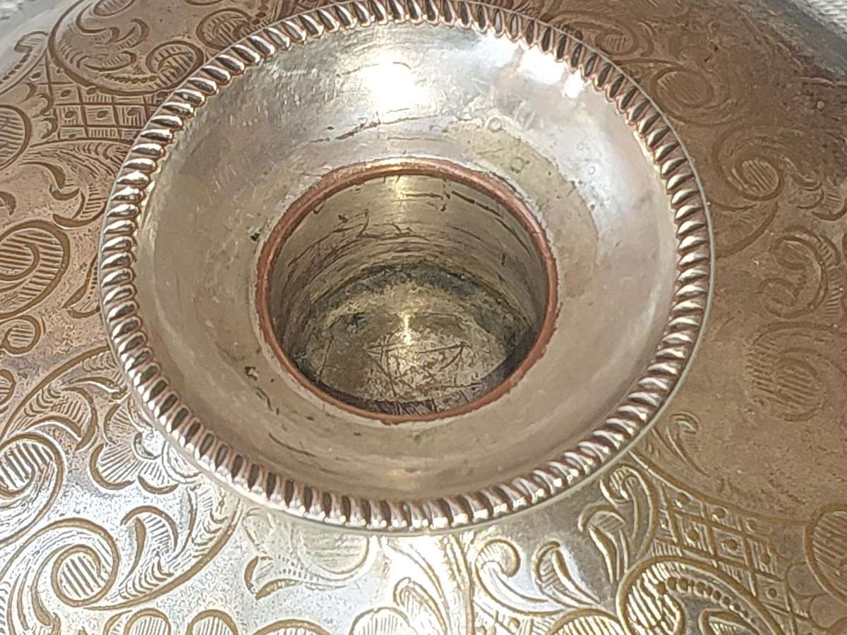 A PAIR OF SILVER PLATE ENGLAND CANDLE HOLDERS WITH ART WORK ENGRAVINGS SOLD AS IS