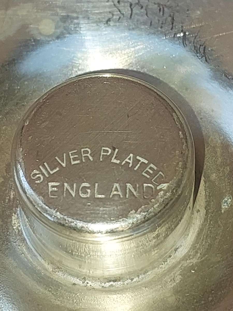 A PAIR OF SILVER PLATE ENGLAND CANDLE HOLDERS WITH ART WORK ENGRAVINGS SOLD AS IS