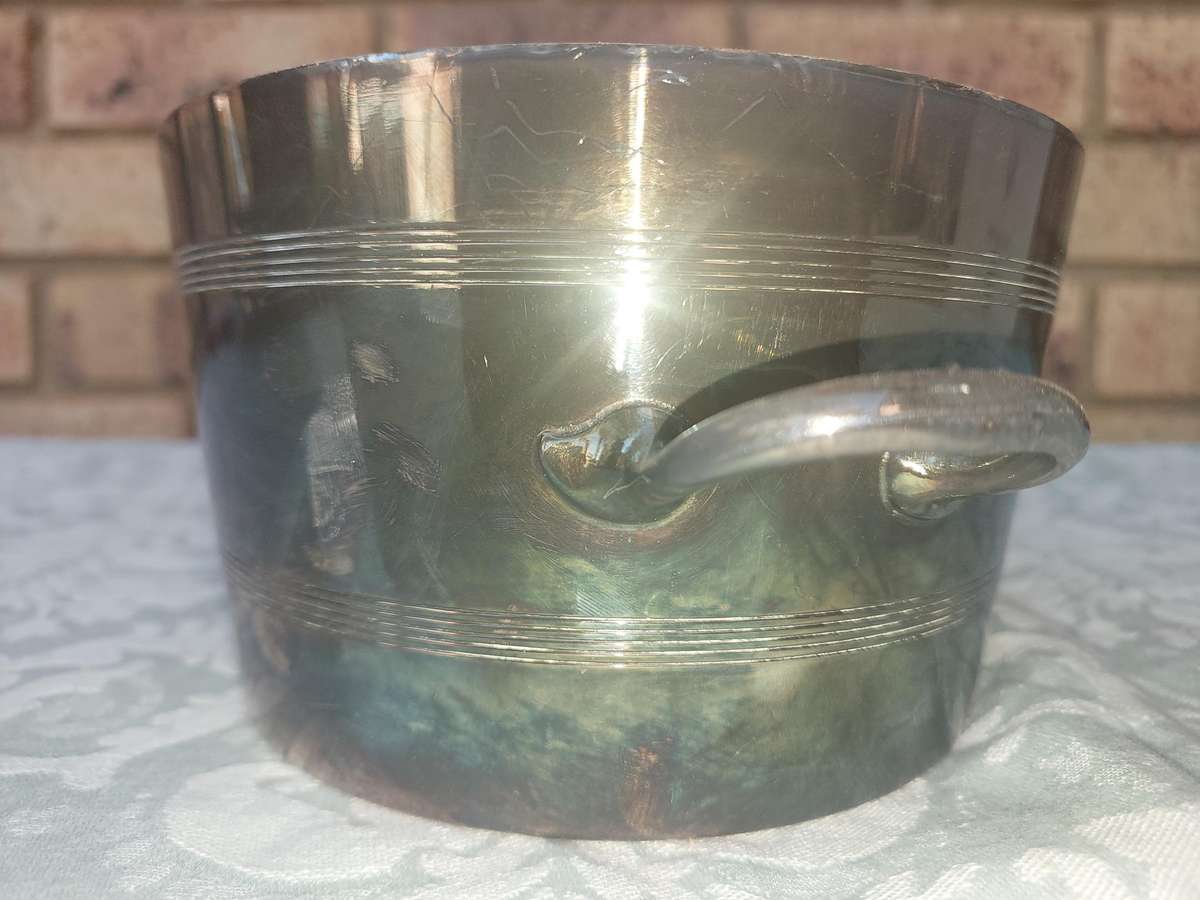 A Mappin and Webb Silver Plated Two-Piece Ice Pail  sold as is