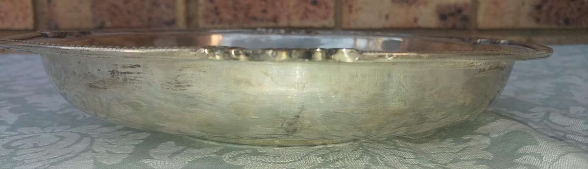 A VINTAGE VICTORIAN SILVER PLATED SERVING BOWL SOLD AS IS