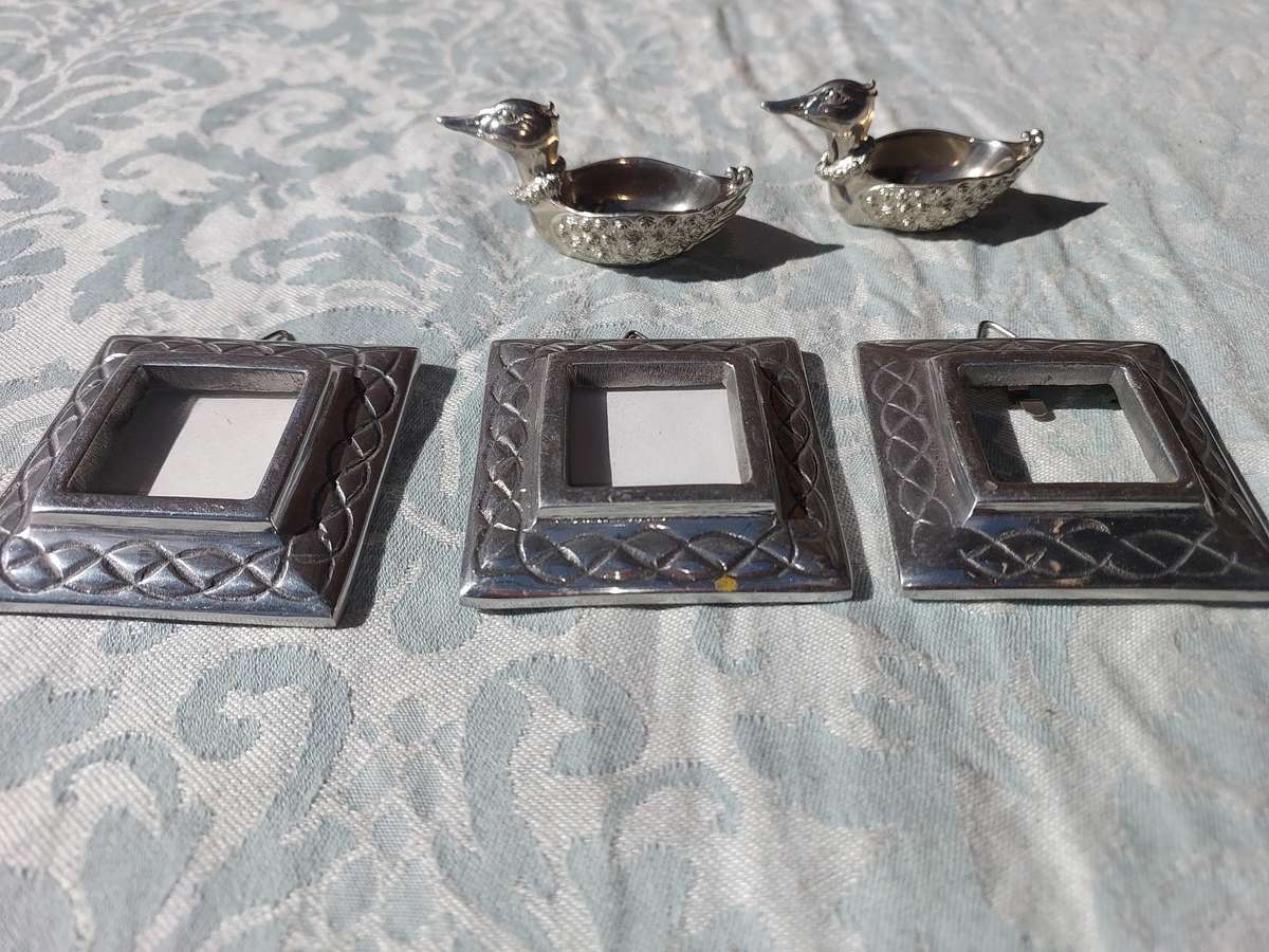 A COLLECTION OF PEWTER PHOTO FRAMES, FIGURINES  AND TWO SILVER PLATE DUCK SALTS