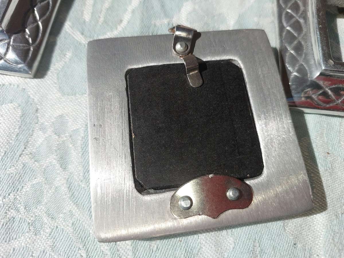 A COLLECTION OF PEWTER PHOTO FRAMES, FIGURINES  AND TWO SILVER PLATE DUCK SALTS