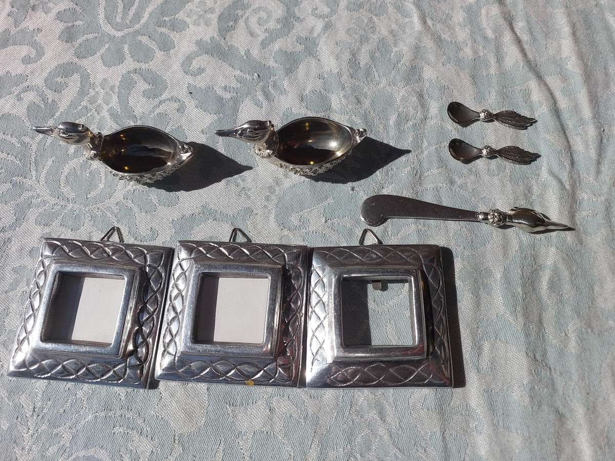 A COLLECTION OF PEWTER PHOTO FRAMES, FIGURINES  AND TWO SILVER PLATE DUCK SALTS