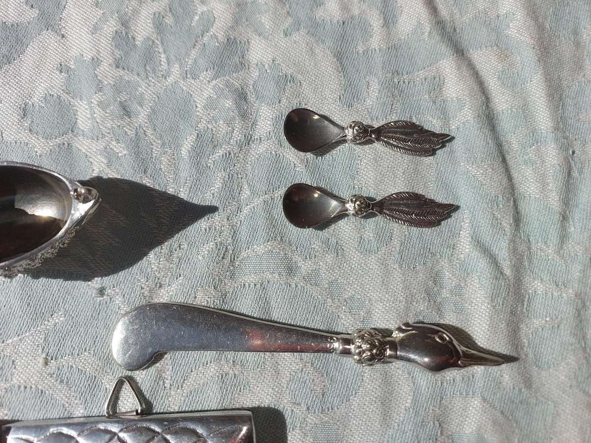 A COLLECTION OF PEWTER PHOTO FRAMES, FIGURINES  AND TWO SILVER PLATE DUCK SALTS