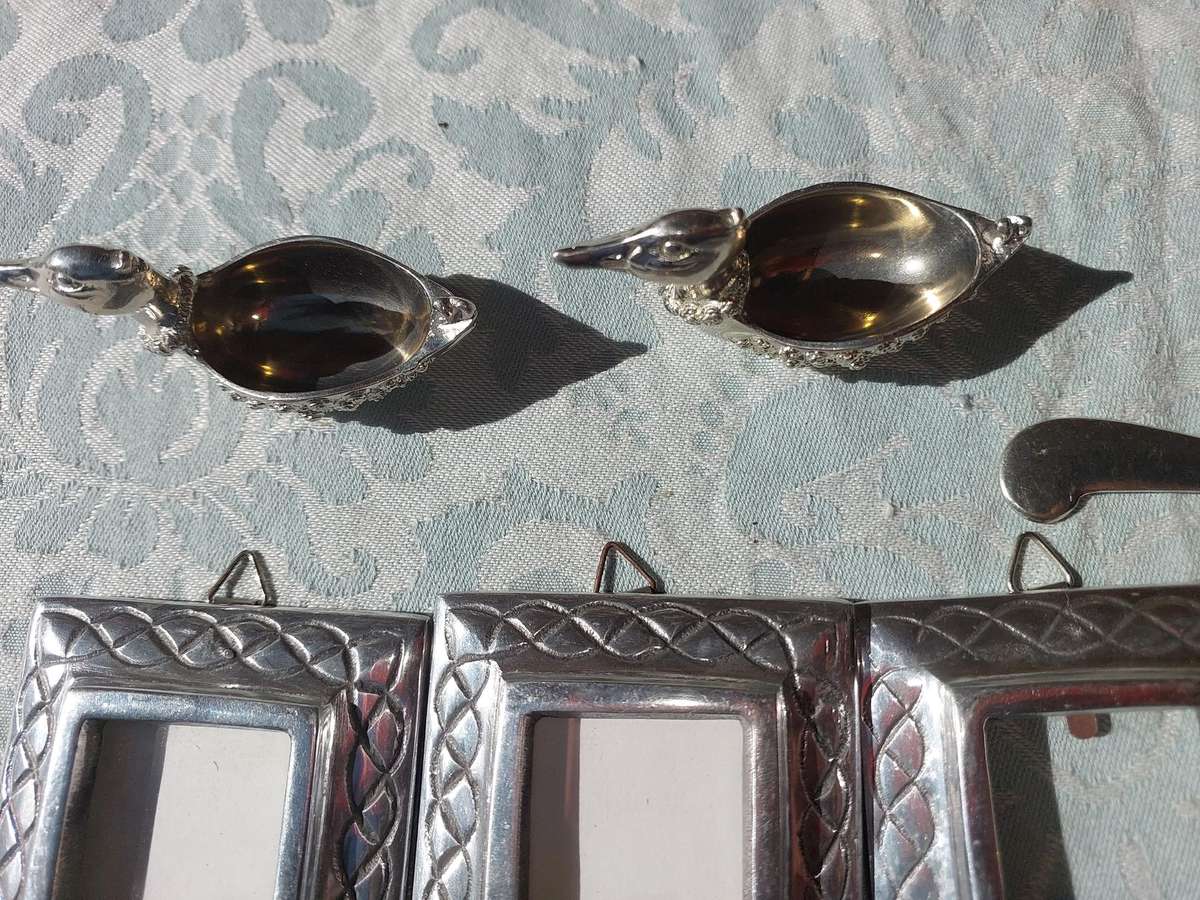 A COLLECTION OF PEWTER PHOTO FRAMES, FIGURINES  AND TWO SILVER PLATE DUCK SALTS