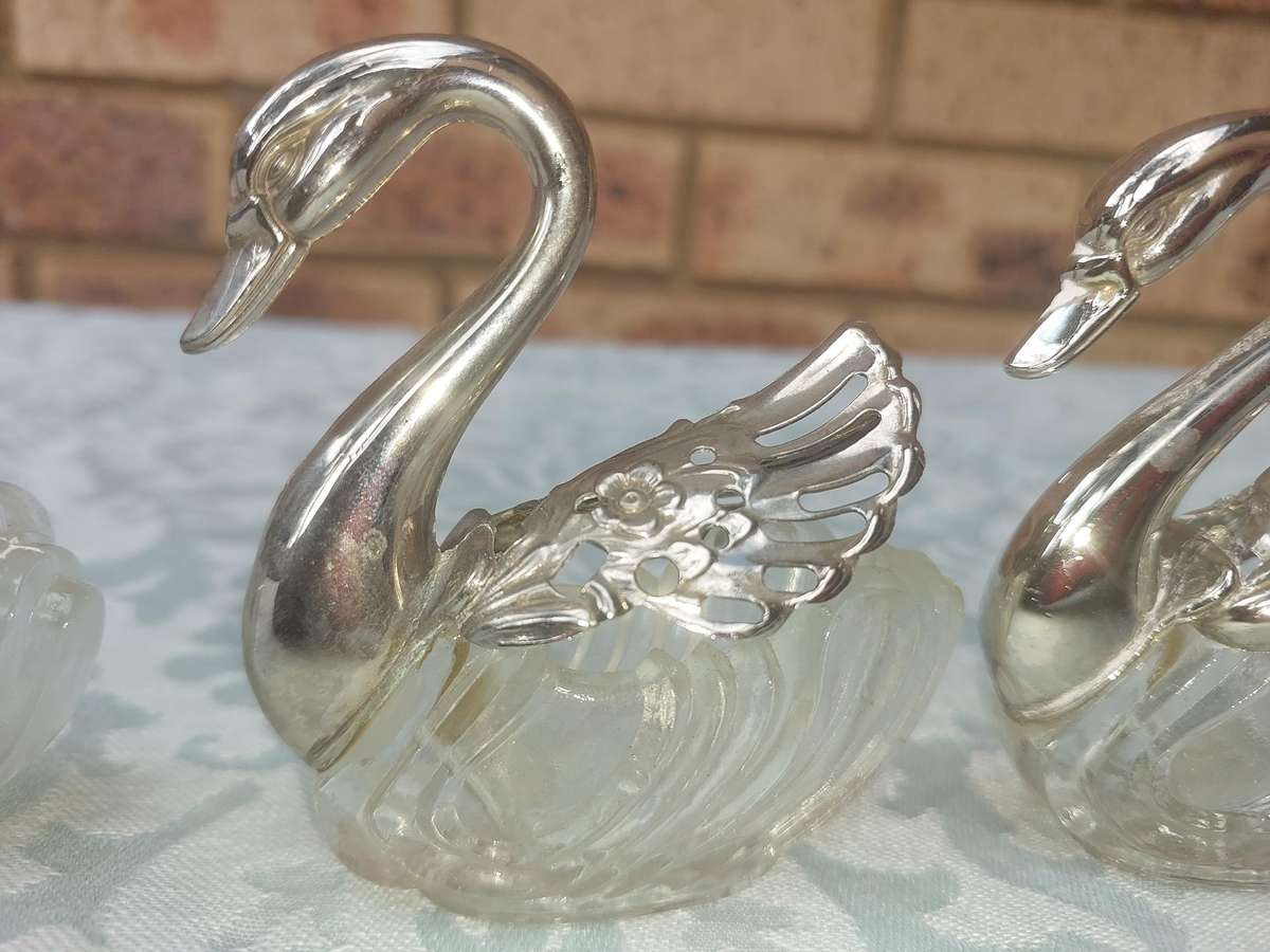 A set of 3 Swan Salt Cellars with out  Spoons Silver Plate vintage sold as is
