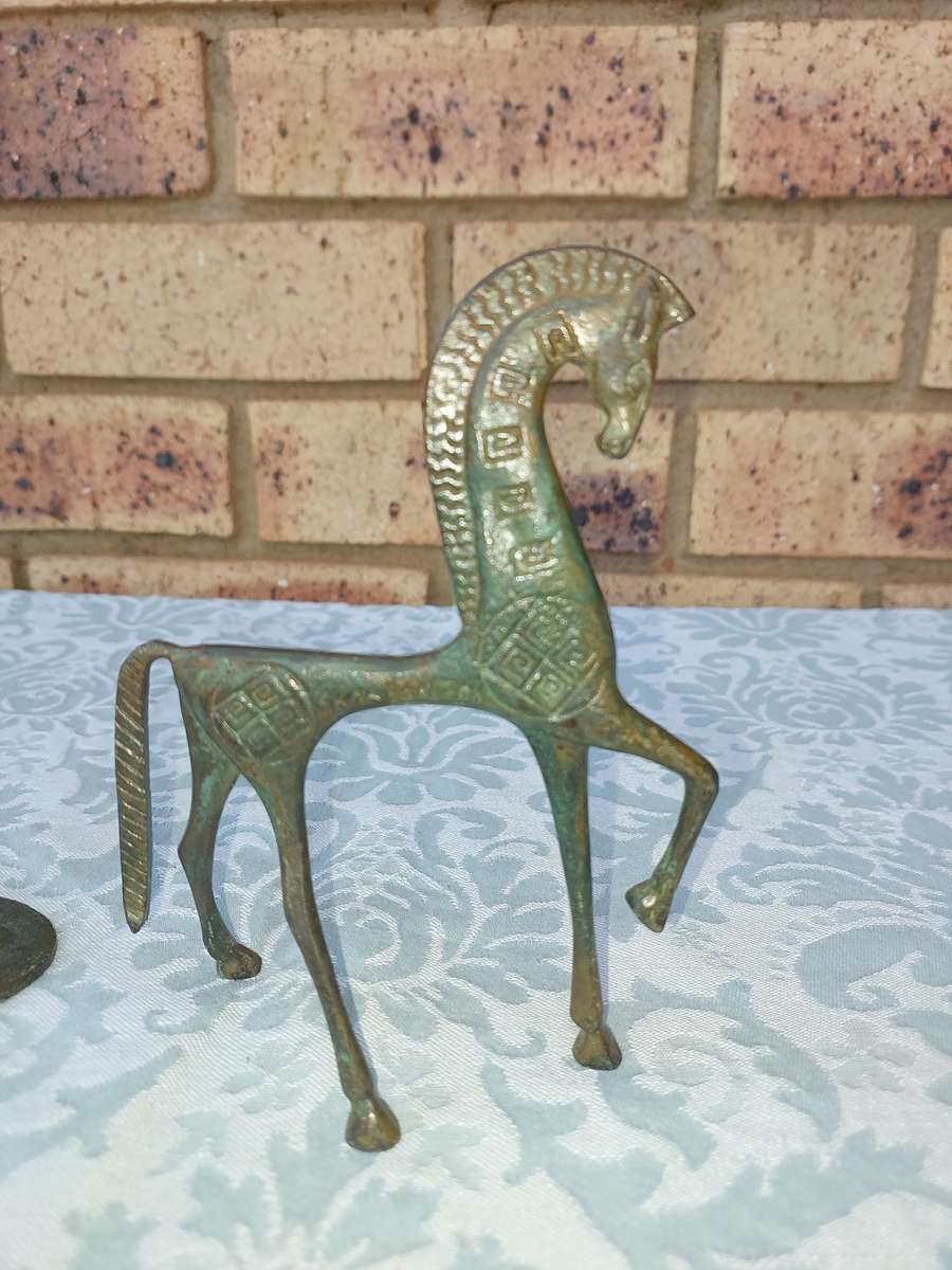 A vintage Mid Century Modern Inspired Metal Etruscan Horse and a nude Greek musician sold as is