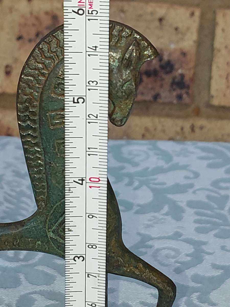 A vintage Mid Century Modern Inspired Metal Etruscan Horse and a nude Greek musician sold as is