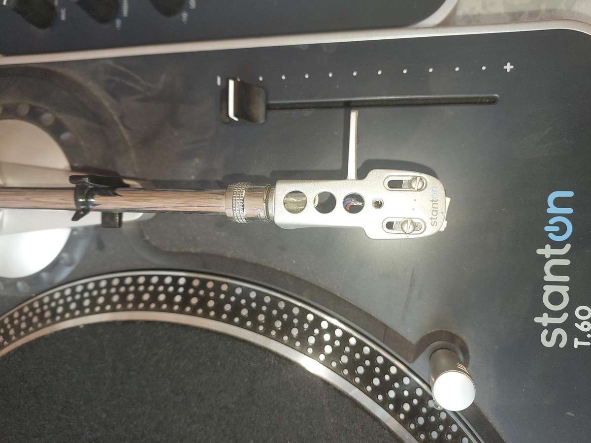 A DJ COLLECTION STANTON TURNTABLES AND A MIXER SWITCHES ON SOLD AS IS