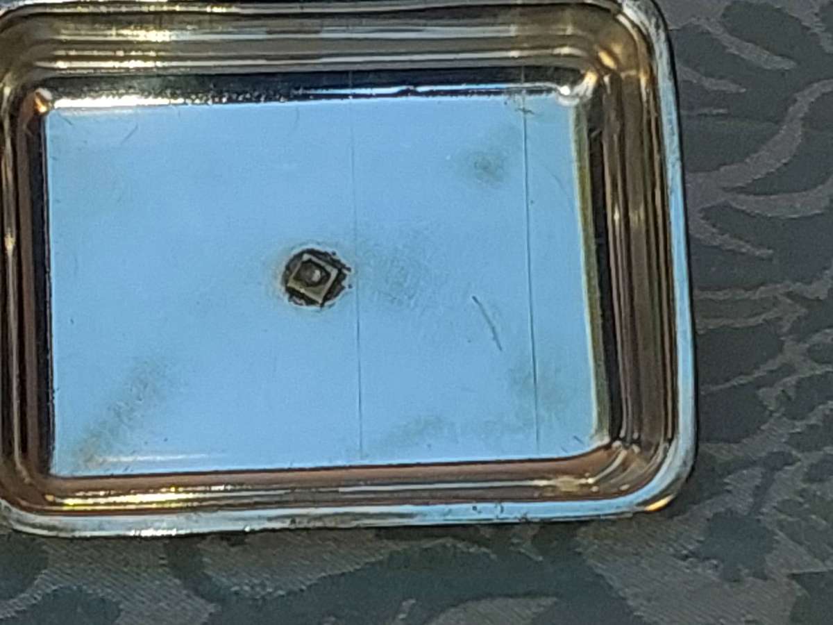 A VINTAGE SILVER PLATED BUTTER DISH SOLD AS IS