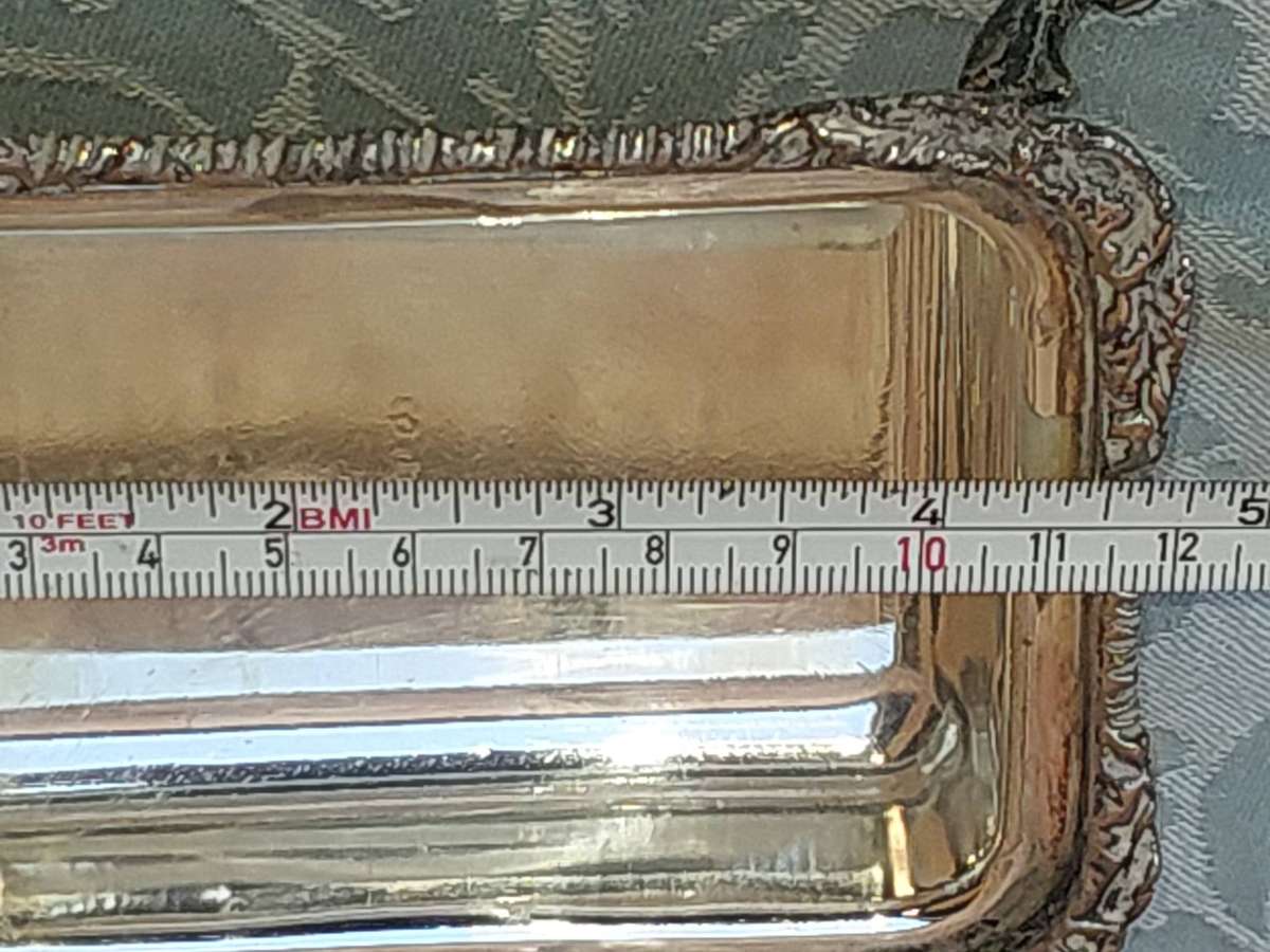 A VINTAGE SILVER PLATED BUTTER DISH SOLD AS IS