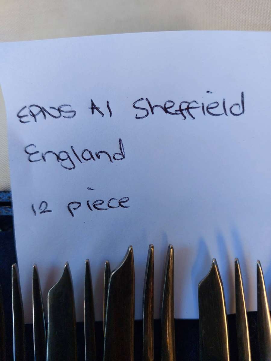 A SET OF 12 EPNS SHEFFIELD CAKE FORKS SOLD AS IS