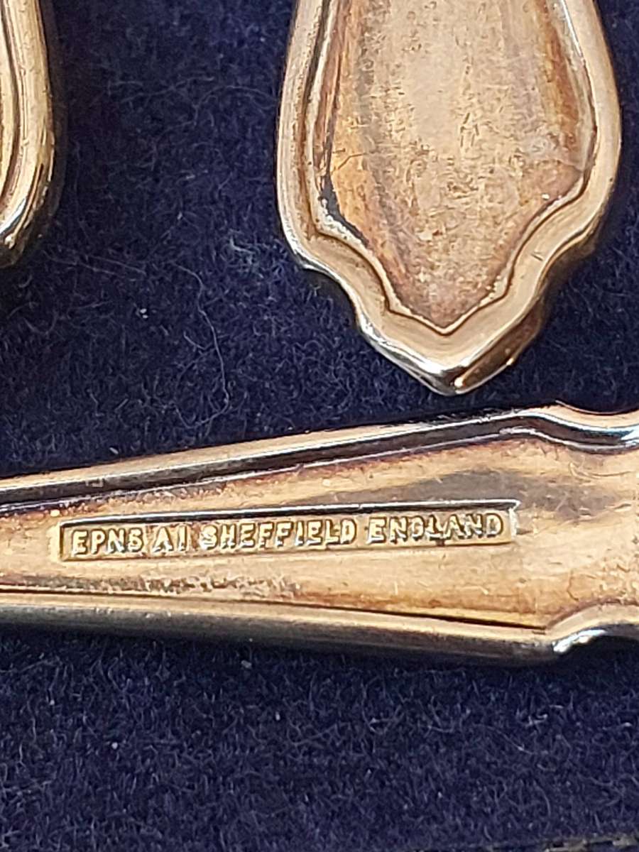 A SET OF 12 EPNS SHEFFIELD CAKE FORKS SOLD AS IS