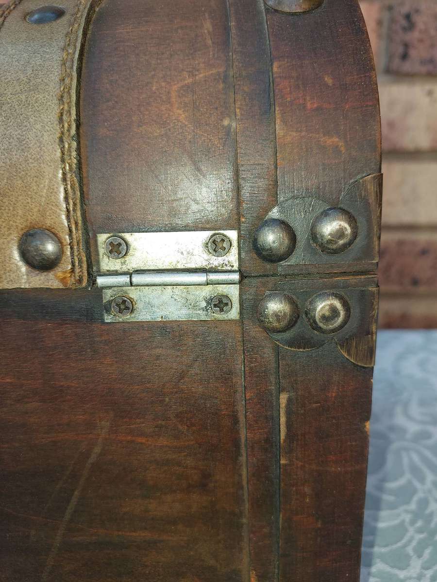 AN ART DECOR WOODEN PIRATES CHEST SOLD AS IS