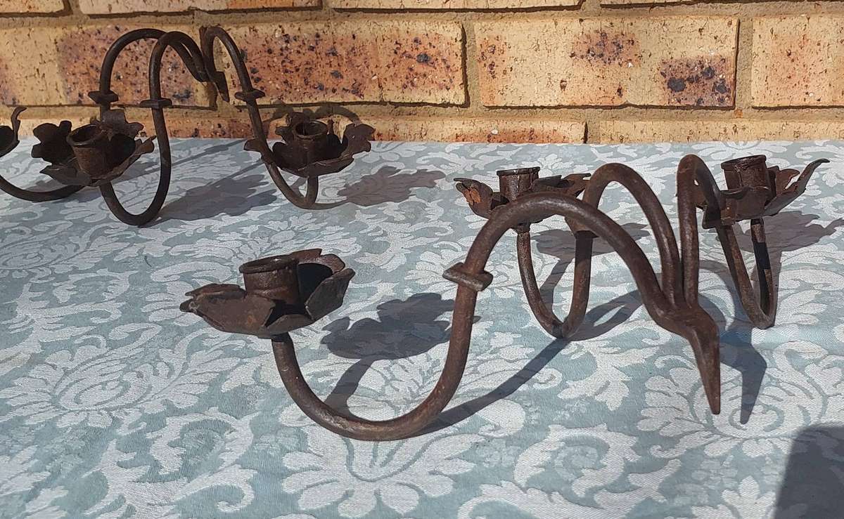 A VINTAGE  PAIR OF WRATH IRON  WALL CANDLE HOLDERS SOLD AS IS