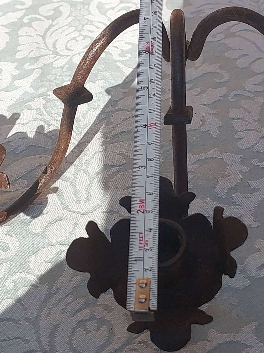 A VINTAGE  PAIR OF WRATH IRON  WALL CANDLE HOLDERS SOLD AS IS