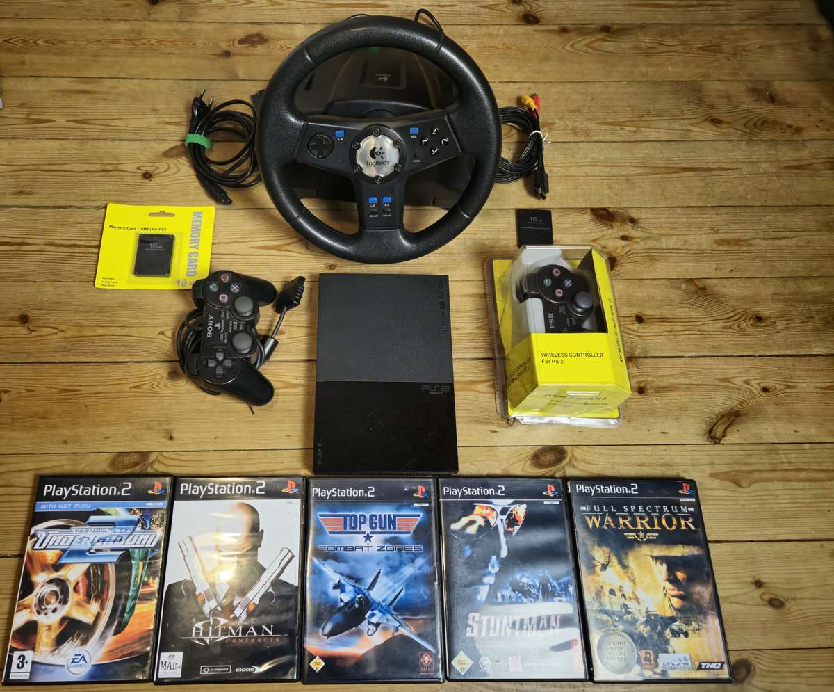 PlayStation 2 Slim Bundle with Logitech Racing Wheel, Controllers, Memory Cards & Games